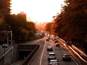Preview wallpaper road, cars, traffic, sunset