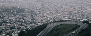 Preview wallpaper road, city, aerial view, fog, buildings, car