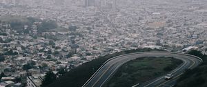 Preview wallpaper road, city, aerial view, fog, buildings, car