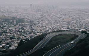 Preview wallpaper road, city, aerial view, fog, buildings, car