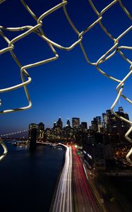 Preview wallpaper road, city, buildings, night, lights, coast, grid