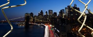 Preview wallpaper road, city, buildings, night, lights, coast, grid