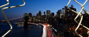 Preview wallpaper road, city, buildings, night, lights, coast, grid