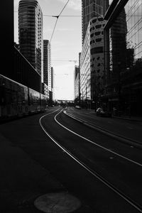 Preview wallpaper road, city, bw, buildings, cars