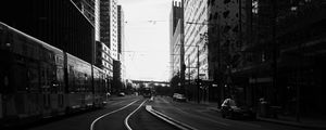 Preview wallpaper road, city, bw, buildings, cars