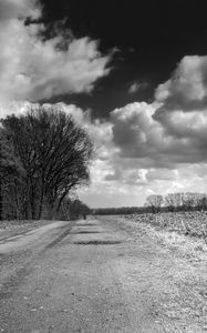 Preview wallpaper road, country, black-and-white, trees, clouds, volume