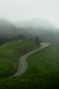 Preview wallpaper road, curve, grass, trees, hills, nature