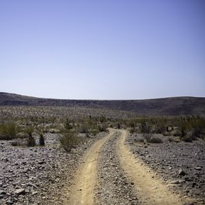 Preview wallpaper road, desert, bushes, hills