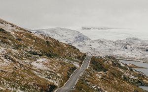 Preview wallpaper road, distance, rocks, snow, snowy