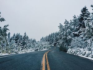Preview wallpaper road, distance, winding, trees, snow, snowy