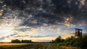 Preview wallpaper road, field, construction, evening, clouds