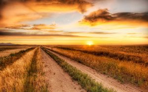 Preview wallpaper road, field, evening, horizon, sun, clouds, sky