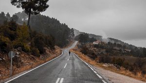 Preview wallpaper road, fog, silhouette, loneliness, tree