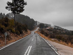 Preview wallpaper road, fog, silhouette, loneliness, tree