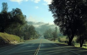 Preview wallpaper road, fog, trees, mountains, morning, landscape