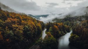 Preview wallpaper road, forest, autumn, fog, clouds
