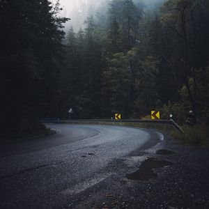 Preview wallpaper road, forest, fog, turn, asphalt, trees