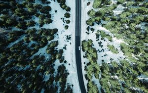 Preview wallpaper road, forest, snow, trees, aerial view