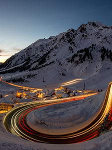 Preview wallpaper road, freezelight, mountains, houses, snow, night