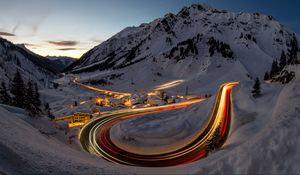 Preview wallpaper road, freezelight, mountains, houses, snow, night