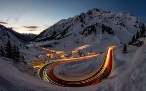 Preview wallpaper road, freezelight, mountains, houses, snow, night