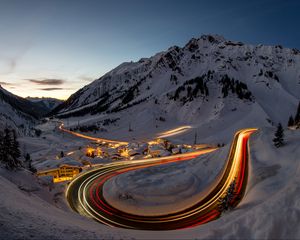 Preview wallpaper road, freezelight, mountains, houses, snow, night