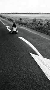 Preview wallpaper road, girl, pose, asphalt, field, bw