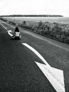 Preview wallpaper road, girl, pose, asphalt, field, bw