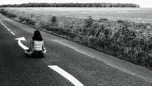 Preview wallpaper road, girl, pose, asphalt, field, bw