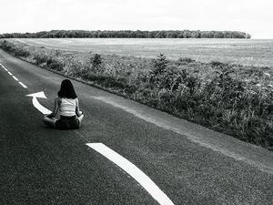 Preview wallpaper road, girl, pose, asphalt, field, bw