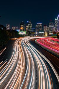 Preview wallpaper road, glow, buildings, long exposure, city, night