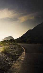 Preview wallpaper road, grass, counting, dawn, mountains