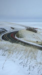 Preview wallpaper road, grass, dry, snow, winter, long exposure