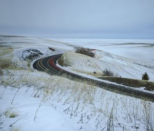 Preview wallpaper road, grass, dry, snow, winter, long exposure