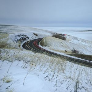 Preview wallpaper road, grass, dry, snow, winter, long exposure