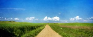 Preview wallpaper road, grass, summer, sun, sky, clouds