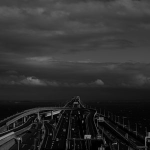 Preview wallpaper road, highway, bw, sky, clouds, dark