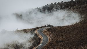 Preview wallpaper road, hill, clouds, aerial view