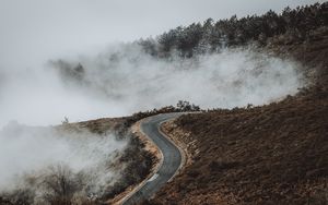 Preview wallpaper road, hill, clouds, aerial view