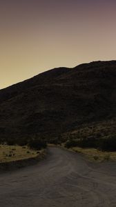 Preview wallpaper road, hill, winding, dusk