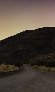 Preview wallpaper road, hill, winding, dusk