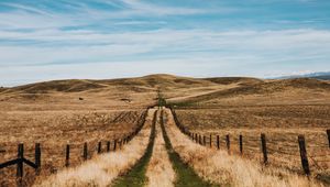 Preview wallpaper road, hills, fields, fence, landscape
