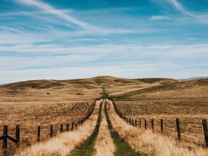 Preview wallpaper road, hills, fields, fence, landscape