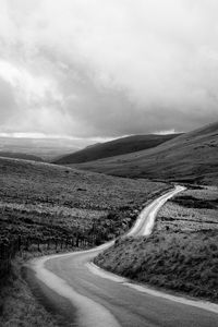 Preview wallpaper road, hills, meadow, valley, black and white