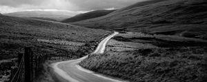 Preview wallpaper road, hills, meadow, valley, black and white