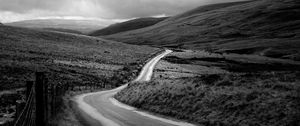 Preview wallpaper road, hills, meadow, valley, black and white