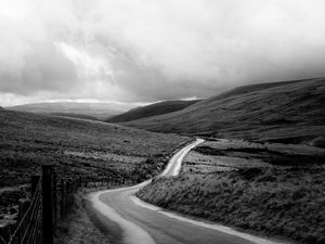 Preview wallpaper road, hills, meadow, valley, black and white