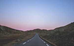 Preview wallpaper road, hills, stones, dusk, nature