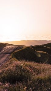 Preview wallpaper road, hilly, relief, landscape, sunrise