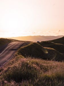 Preview wallpaper road, hilly, relief, landscape, sunrise